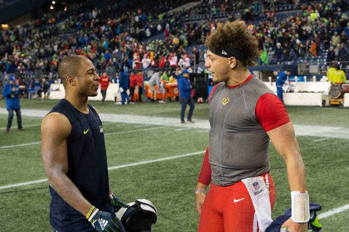Dec 23, 2018; Seattle, WA, USA; Seattle Seahawks wide receiver Tyler Lockett (16) and Kansas City Chiefs quarterback Patrick Mahomes (15) talk after the game at CenturyLink Field. Seattle defeated Kansas City 38-31. Mandatory Credit: Steven Bisig-USA TODAY Sports